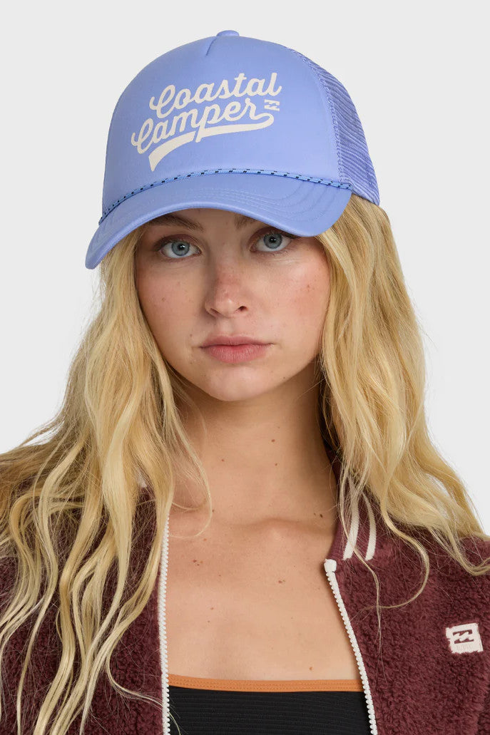 Person wearing a blue cap with 'Coastal Camper' text and a maroon jacket with a logo.