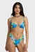 Woman wearing a colorful floral bikini on a white background