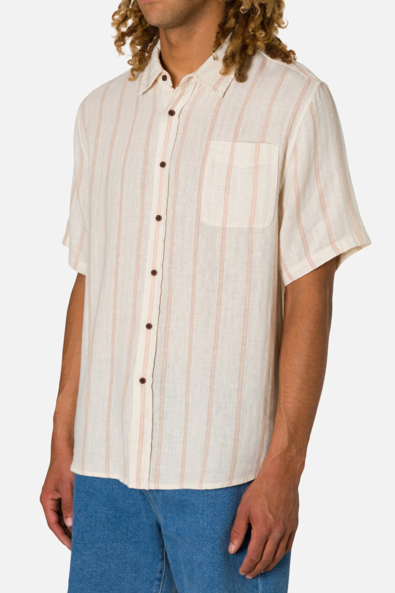 Man wearing a beige striped shirt with short sleeves on a white background