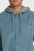 Blue corduroy shirt with gray hood and brand logo on a white background