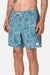 Man wearing blue patterned shorts on a white background