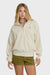 Woman wearing a beige fleece pullover with a brand logo on a white background