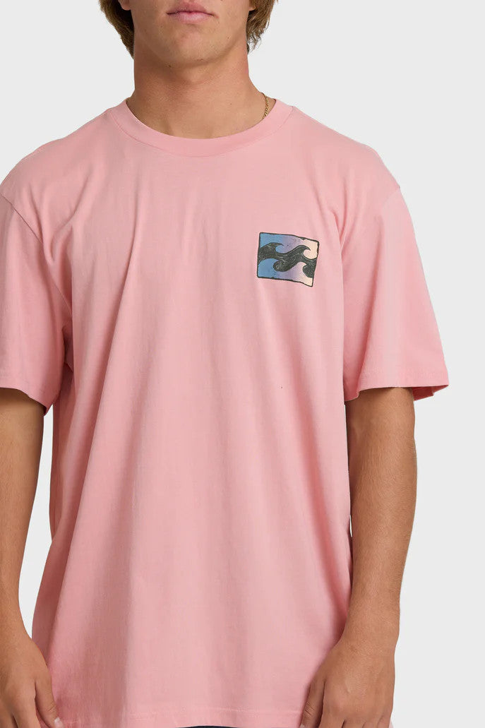 Man wearing a pink t-shirt with a wave design on the chest against a white background