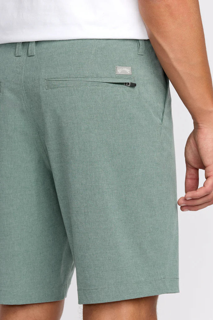 Green shorts with a brand logo on a white background