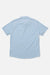 Back view of a light blue shirt on a white background