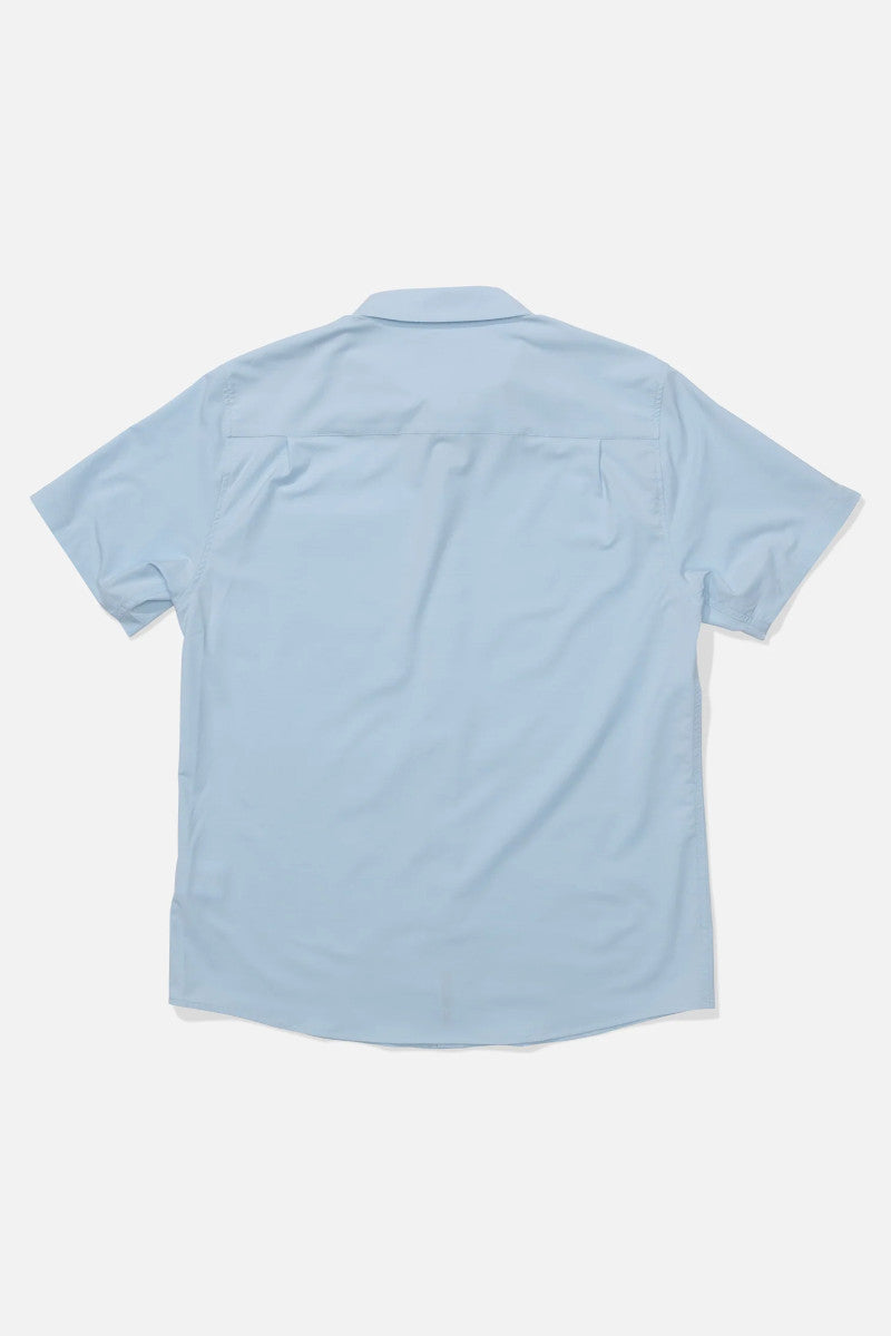 Back view of a light blue shirt on a white background