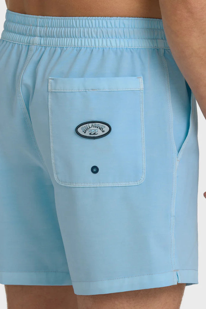 Man wearing light blue swim shorts with an elastic waist and drawstring on a white background