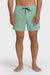 Man wearing light green swim shorts with an elastic waist and drawstring on a white background