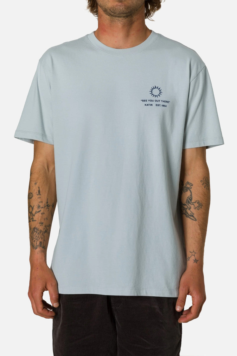 Light blue t-shirt with a small graphic on a plain background