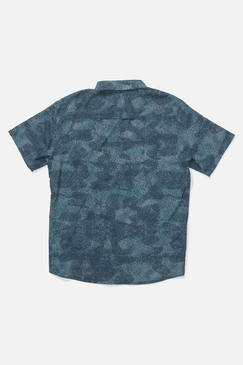 Back view of a blue patterned shirt on a white background