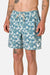 Man wearing blue floral shorts on a plain background