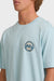 Person wearing a light blue t-shirt with a Billabong logo