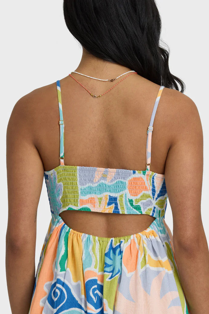 Colorful patterned dress with cutout back design on a plain background