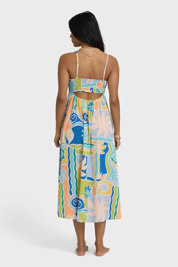 Woman wearing a colorful patterned dress on a white background