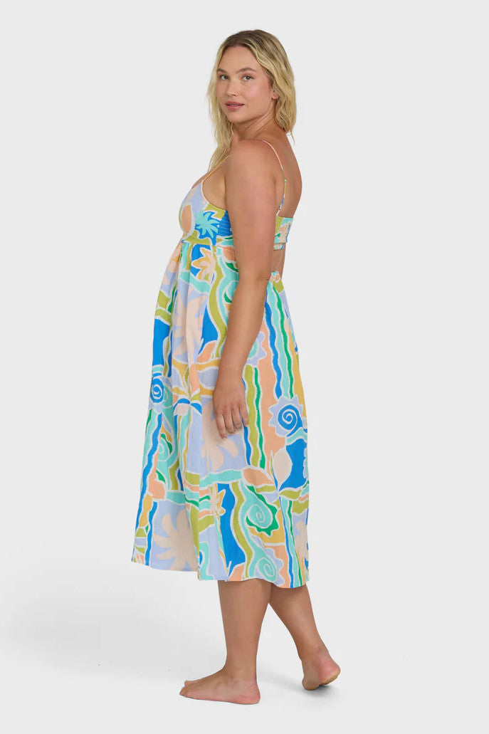 Woman wearing a colorful dress with a white background