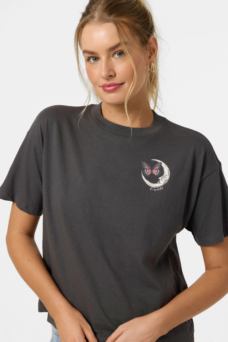 Woman wearing a black t-shirt with a graphic design on a white background