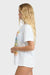 Woman wearing a white tee against a white background