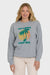 Woman wearing a gray sweatshirt with a palm tree design and 'Billabong Since 1973' text on a white background