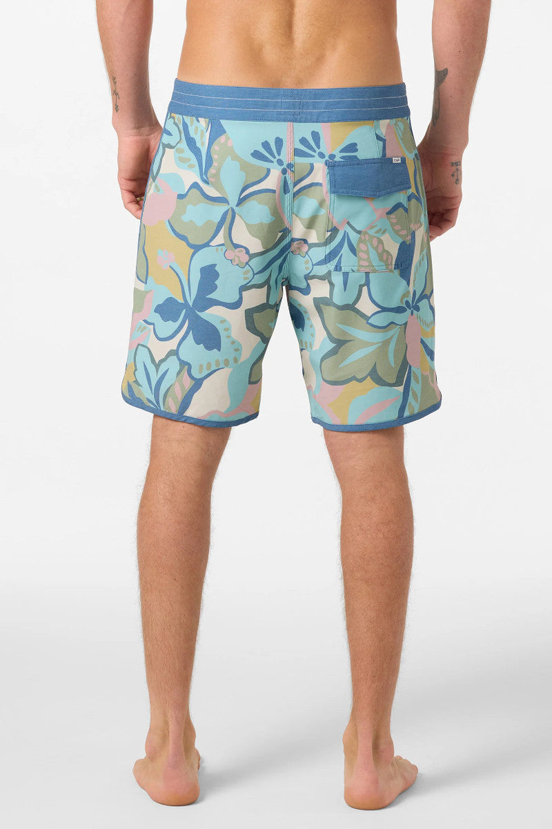 Person wearing colorful floral-patterned shorts on a white background