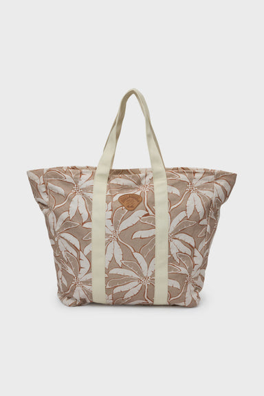 Floral-patterned tote bag with beige straps on a white background