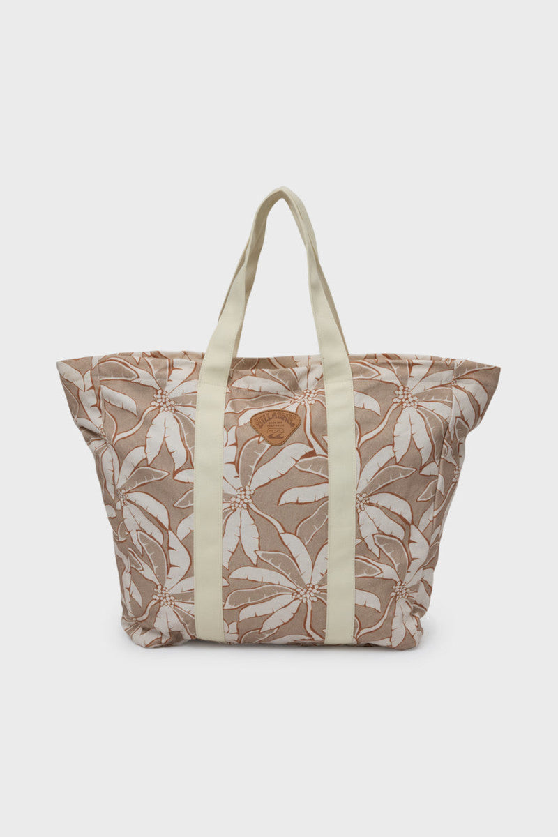 Floral-patterned tote bag with beige straps on a white background