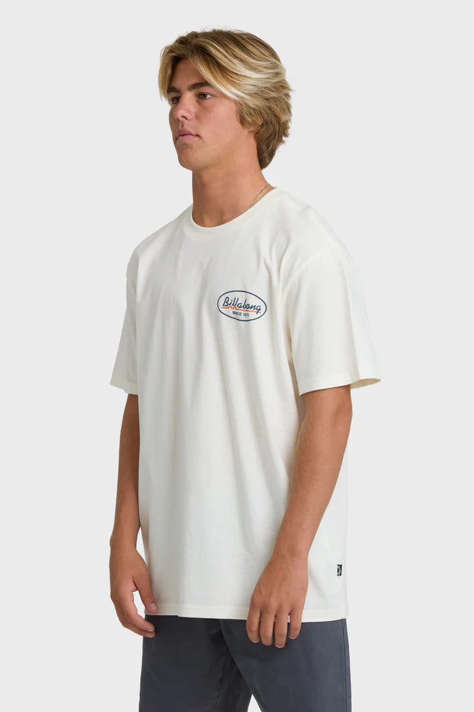 Person wearing a white t-shirt with a logo on a plain background