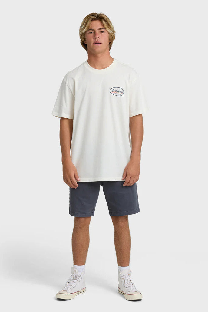 Person wearing a white t-shirt with a logo and gray shorts on a white background