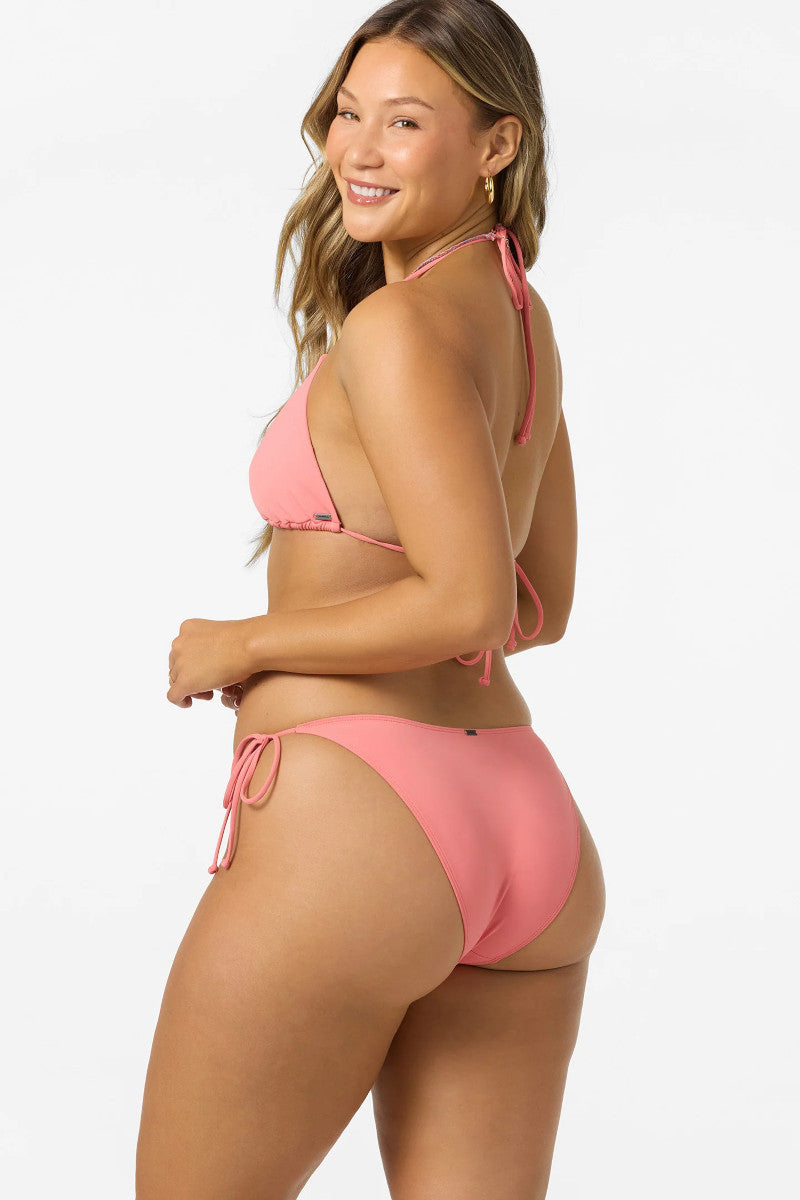 Woman wearing a pink bikini on a white background
