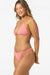 Woman wearing a pink bikini on a white background