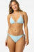 Woman wearing a light blue bikini set on a white background