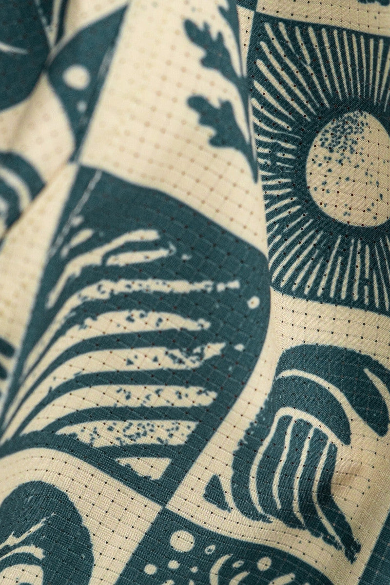 Close-up of fabric with blue and beige abstract patterns