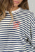 Navy and white striped sweatshirt with red text on a plain background. Text says "Salty Crew Thrill Seekers Risk Takers"