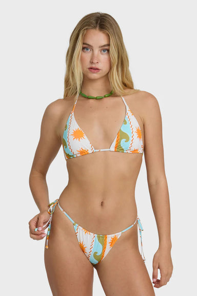Woman wearing a colorful bikini set on a white background