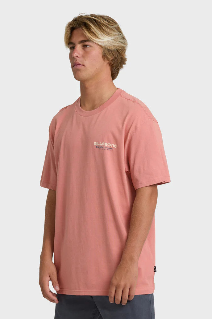 Person wearing a pink t-shirt with a logo on a white background