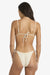 Woman wearing a beige bikini with thin straps on a white background