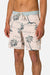 Person wearing a tropical print shorts with palm trees on a plain background