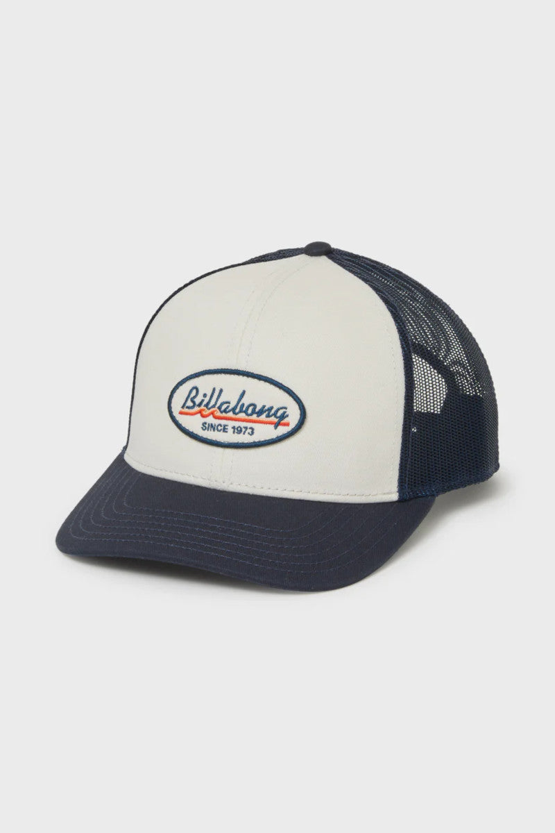 Navy and white cap with Billabong logo on a light gray background