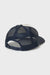 Navy blue and white cap with mesh back on a light gray background
